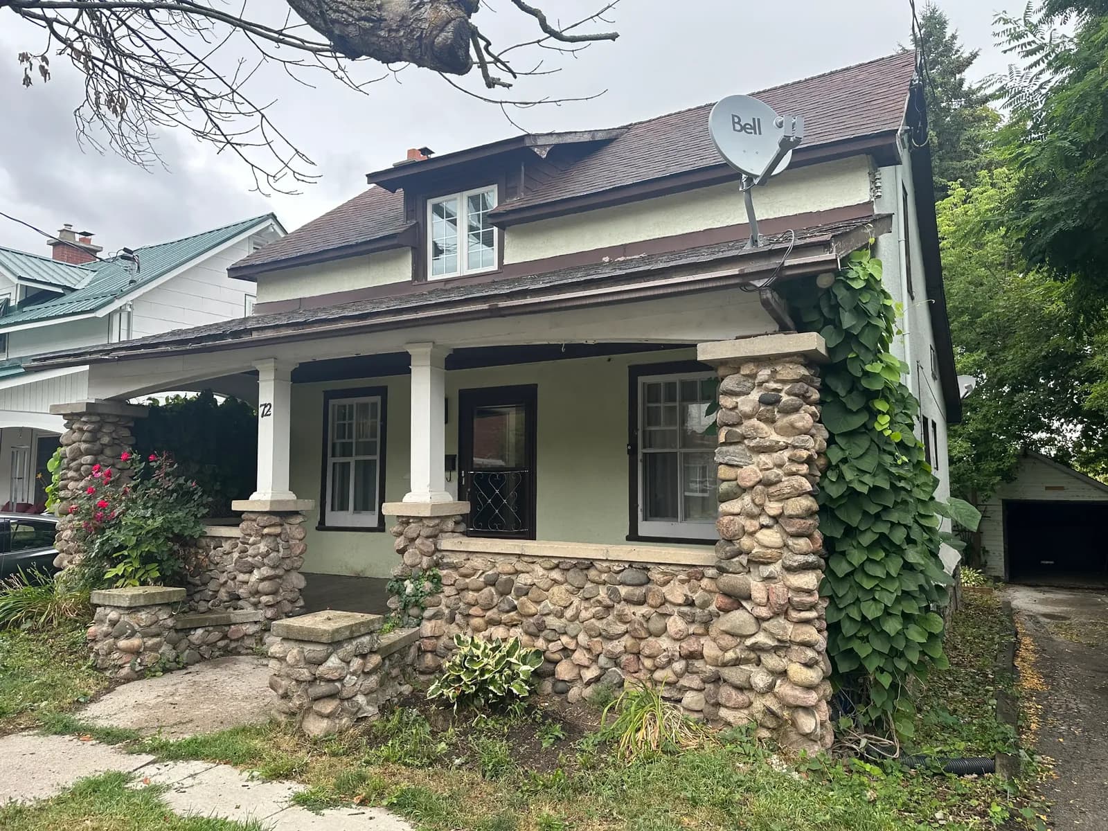 Iowa bungalow with a covered front porch, the kind of home Cash For Homes Iowa buys for cash, as-is.