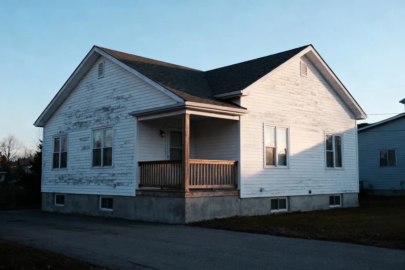 Modest Iowa bungalow of the kind sold for cash by owners who have fallen behind on mortgage payments.