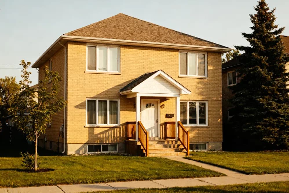 Two-story family home in Iowa of the kind sold for cash during a divorce or separation.