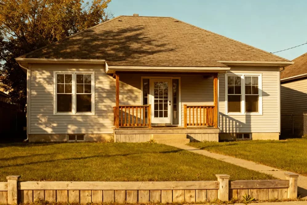 Single-story Iowa home with a front porch, sold for cash after a job loss or medical hardship.